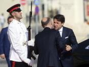 Italian Premier Giuseppe Conte, right, is welcomed by Malta Prime Minister Joseph Muscat, on the occasion of the Mediterranean Summit of Southern EU countries in Valetta, Malta, Friday, June 14, 2019. (AP Photo/Jonathan Borg)