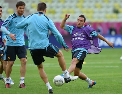 File photo shows Spanish midfielder Santi Cazorla (R) during a team training session in June. Manager Arsene Wenger on Saturday denied speculation that Arsenal were about to buy Cazorla, saying the club were "not close to signing anybody"