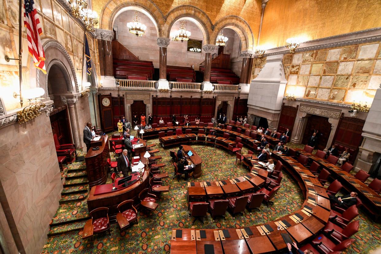 New York Lt. Gov. Antonio Delgado ,left, presides over the Senate during a special legislative session to consider new firearms regulations for concealed-carry permits in the Senate Chamber at the state Capitol Thursday, June 30, 2022, in Albany, N.Y.