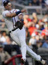 Atlanta Braves third baseman Austin Riley throws to first after fielding a ball hit for a single by Washington Nationals' Yan Gomes in the sixth inning of a baseball game Monday, May 31, 2021, in Atlanta. Riley's throw was wild and allowed Gomes to advance to second base. (AP Photo/John Bazemore)