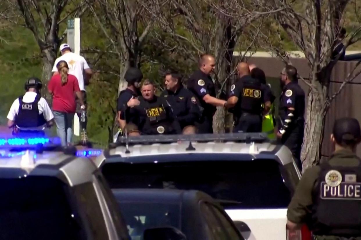 Law enforcement officers assemble near the Covenant School after a shooting in Nashville, Tennessee, U.S. March 27, 2023 in a still image from video (via REUTERS)