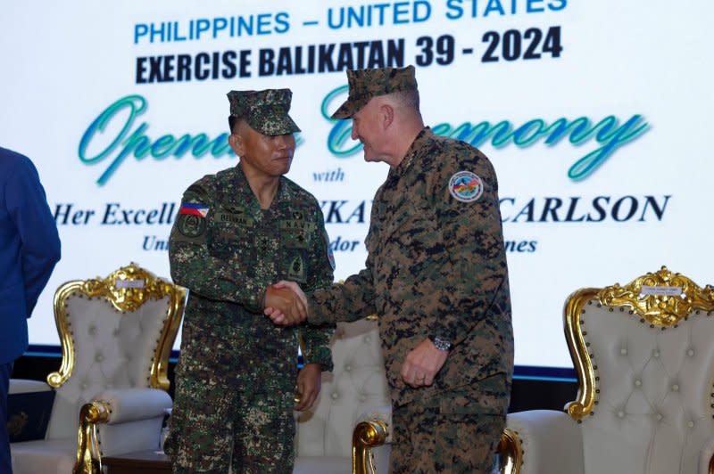 Armed Forces of the Philippines Gen. Romeo S. Brawner Jr. (L) shakes hands with U.S. Marine Corps Lt. Gen. William M. Jurney during the opening ceremony of the Balikatan 2024 joint exercise at Camp Aguinaldo, Philippines on Monday. Photo by Lance Cpl. Erica Stanke/U.S. Marine Corps