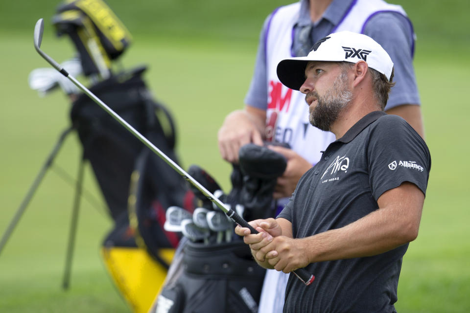 Ryan Moore watches his shot on the 18th hole during the first round of the 3M Open golf tournament in Blaine, Minn., Thursday, July 23, 2020. (AP Photo/Andy Clayton- King)