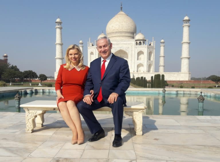 Sara and Benjamin Netanyahu pose at the Taj Mahal in Agra on January 16, 2018, during a visit to India