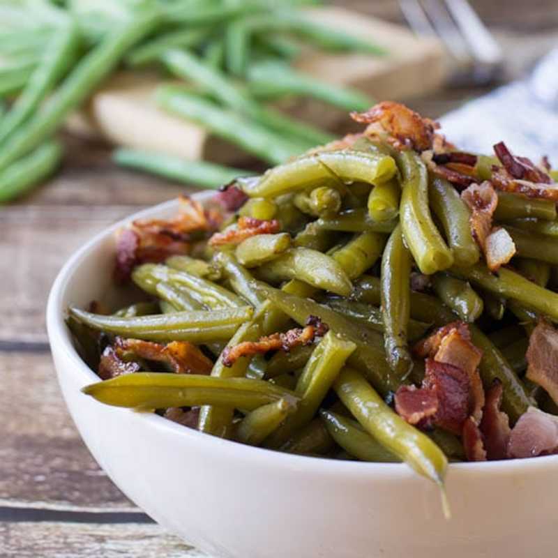 <p>Courtesy of SpicySouthernKitchen.com</p><p>Southern-Style Green Beans are cooked long and slow until they become melt in your mouth tender. Flavored with lots of bacon.</p><p><strong>Get the recipe: <a href="https://spicysouthernkitchen.com/southern-style-green-beans/" rel="nofollow noopener" target="_blank" data-ylk="slk:Southern-Style Green Beans;elm:context_link;itc:0;sec:content-canvas" class="link rapid-noclick-resp">Southern-Style Green Beans</a></strong></p>