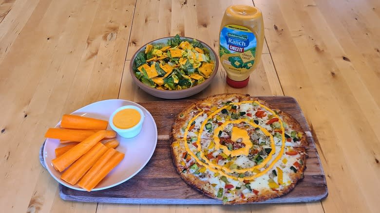 cheez it ranch dressing on a pizza, salad, and carrots