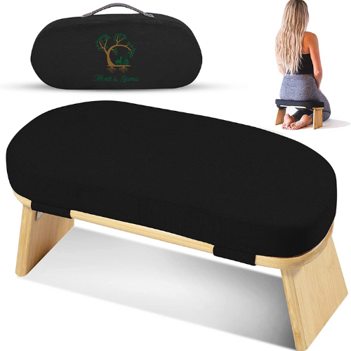light wood meditation bench with black cushion and a black bag with a woman kneeling on the mediation bench