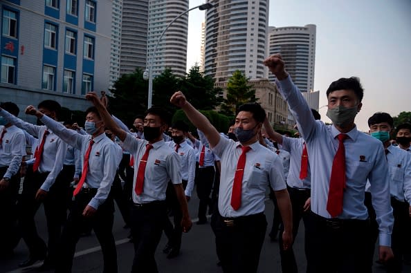 North Korean students take part in a rally denouncing 'defectors from the North' as they march from the Pyongyang Youth Park Open-Air Theatre to Kim Il Sung Square in Pyongyang.