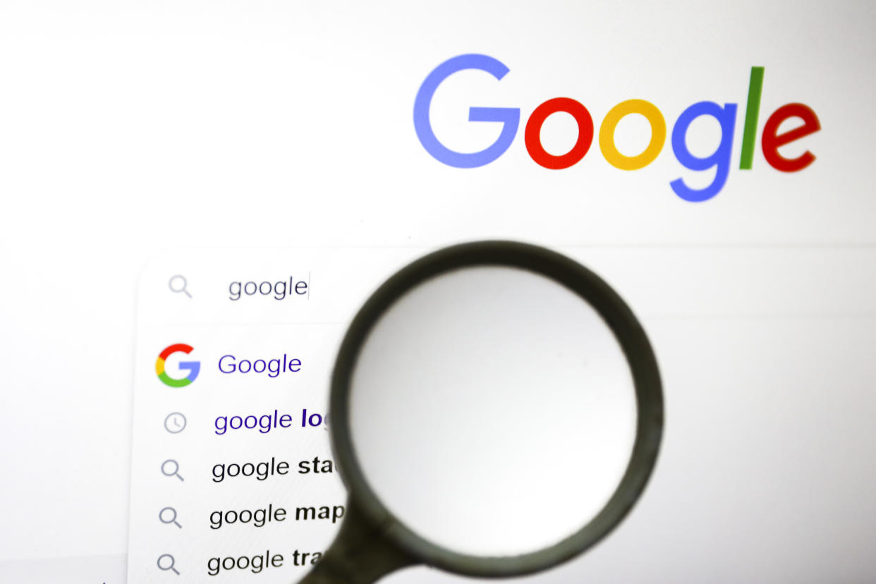 A magnifying glass is photographed with Google logo displayed on a laptop screen for illustration photo. Gliwice, Poland on January 23, 2022. (Photo by Beata Zawrzel/NurPhoto via Getty Images)