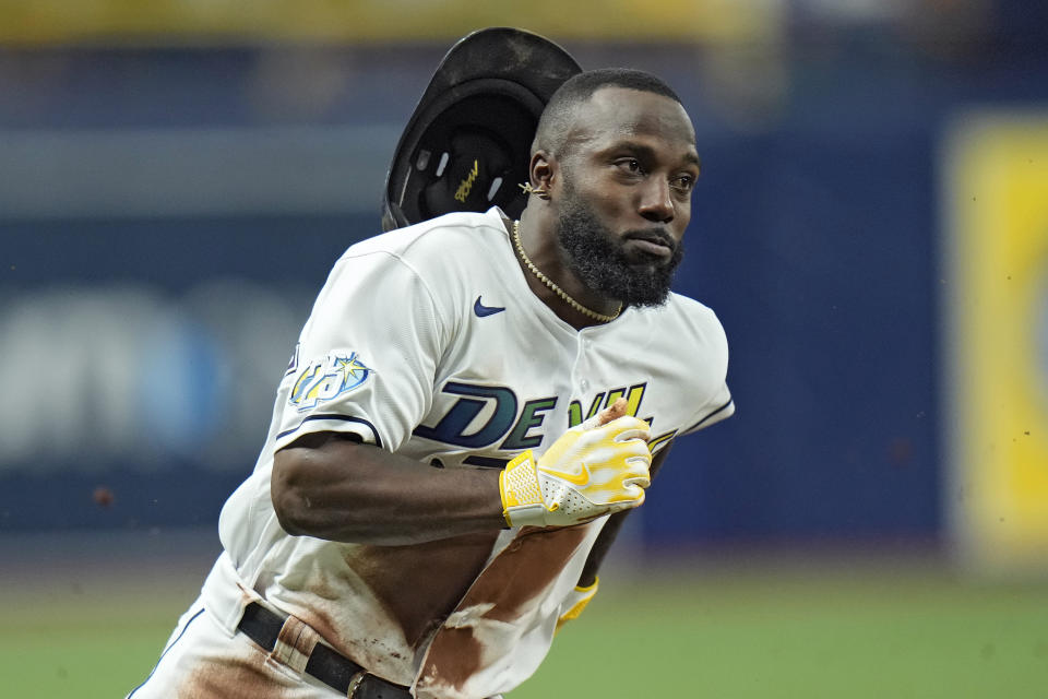 Tampa Bay Rays' Randy Arozarena scores on an RBI single by Harold Ramirez off Toronto Blue Jays starting pitcher Chris Bassitt during the first inning of a baseball game Friday, Sept. 22, 2023, in St. Petersburg, Fla. (AP Photo/Chris O'Meara)