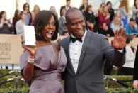 Actors Viola Davis and husband Julius Tennon arrive at the 22nd Screen Actors Guild Awards in Los Angeles, California January 30, 2016. REUTERS/Mike Blake