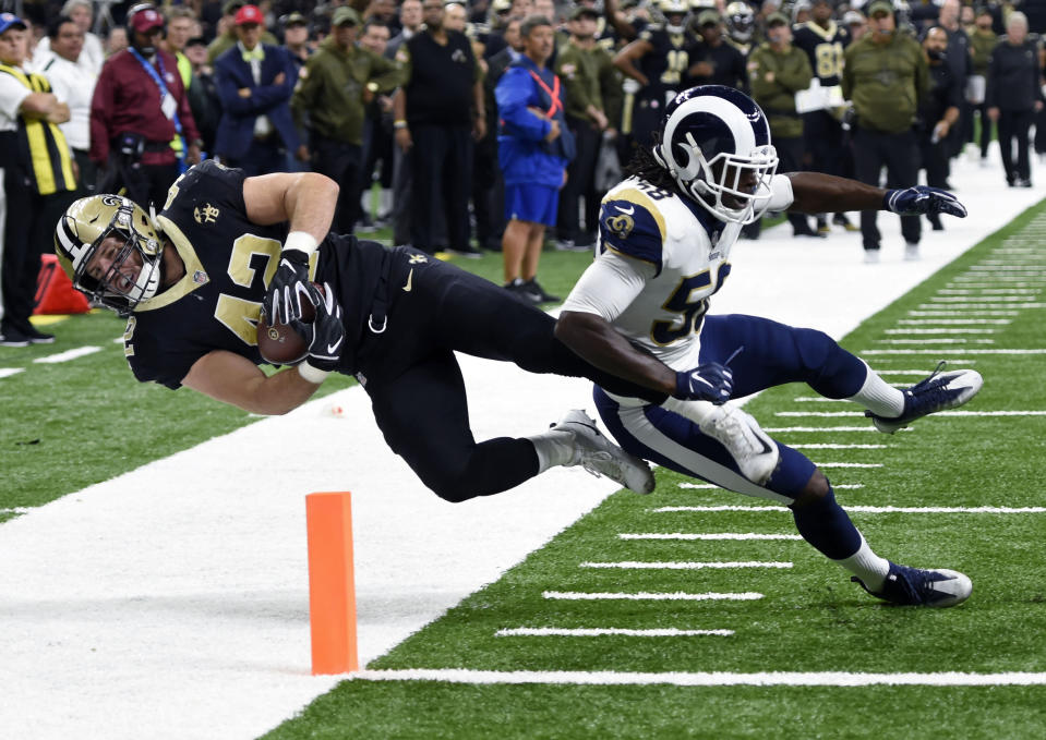 Saints fullback Zach Line lunges for the end zone against Rams linebacker Cory Littleton in a November game. (AP)