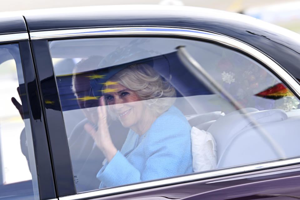 Britain's King Charles III and Camilla, the Queen Consort, arrive at the airport in Berlin, Wednesday, March 29, 2023. King Charles III arrives Wednesday for a three-day official visit to Germany. (Britta Pedersen/dpa via AP)