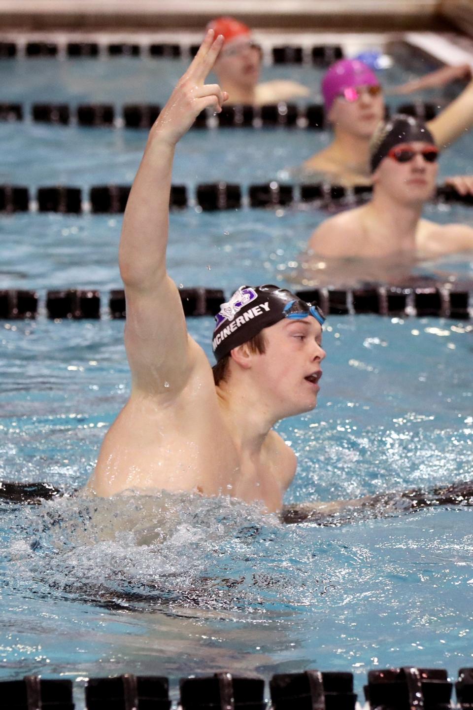 DeSales' Brady McInerney holds up two fingers after winning his second Division II state title, placing first in the 100-yard freestyle after his earlier win in the 50 free Feb. 25 at Branin Natatorium in Canton.