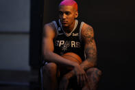 San Antonio Spurs forward Jeremy Sochan (10) poses for photos during the team's NBA basketball Media Day, Monday, Sept. 26, 2022, in San Antonio. (AP Photo/Eric Gay)