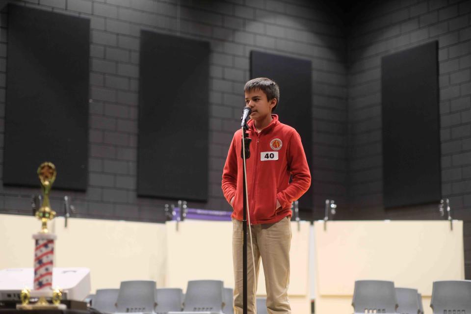 Mihir Chandra, a seventh-grader from Ascension Academy who finished as the runner up, spells the word "enoki" at the Randall County Spelling Bee in Canyon.