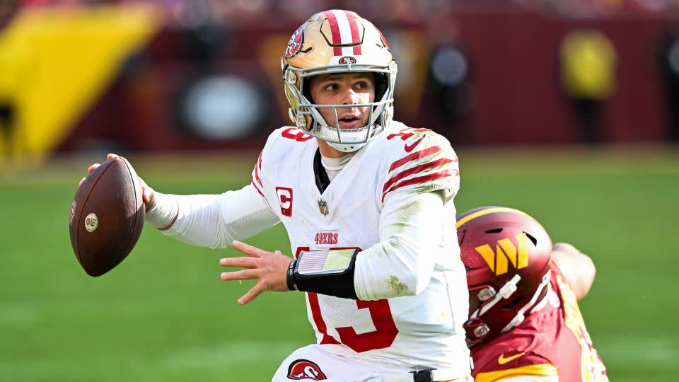 Brock Purdy looks for a pass against the Washington Commanders on December 31. - Greg Fiume/Getty Images