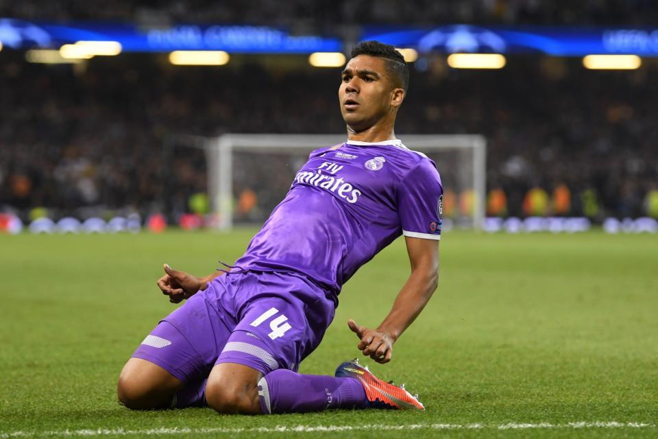 <p>Casemiro of Real Madrid celebrates scoring his sides second goal during the UEFA Champions League Final between Juventus and Real Madrid at National Stadium of Wales on June 3, 2017 in Cardiff, Wales. </p>