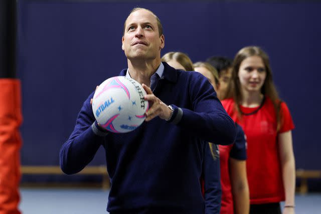 <p>Suzanne Plunkett - WPA Pool/Getty Images</p> Prince William plays netball on Oct. 12, 2023