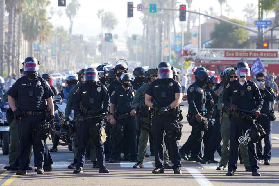 San Diego police set up a security line to keep pro- and anti-Trump groups apart.