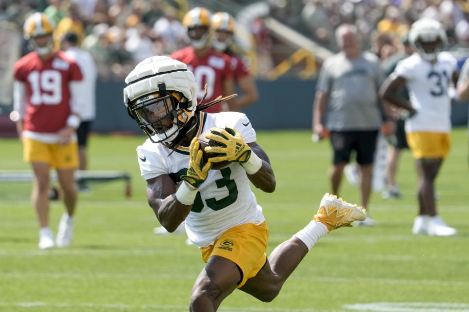 Green Bay Packers' Aaron Jones catches a pass during NFL football training camp Thursday, July 27, 2023, in Green Bay, Wis. (AP Photo/Morry Gash)
