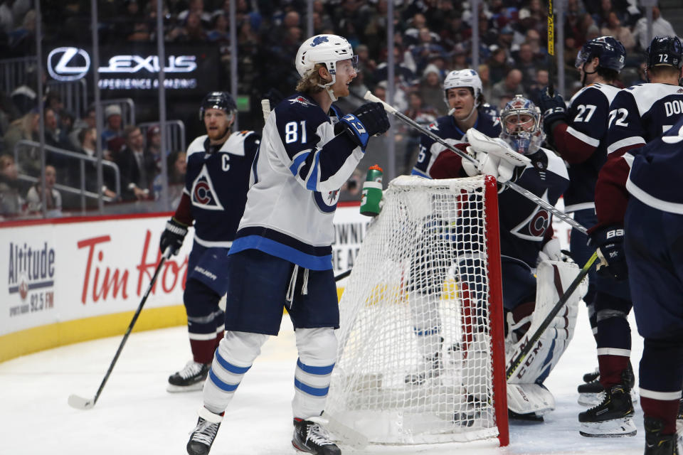 Winnipeg Jets left wing Kyle Connor reacts after scoring a goal against the Colorado Avalanche during the second period of an NHL hockey game Tuesday, Dec. 31, 2019, in Denver. (AP Photo/David Zalubowski)