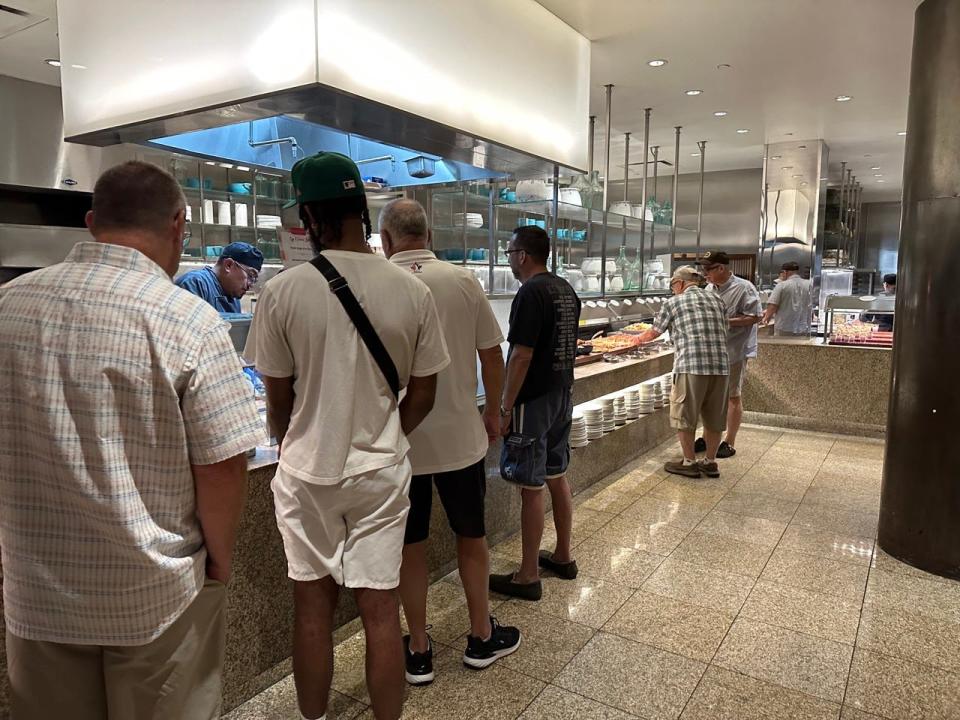 A line of men at a buffet in Las Vegas