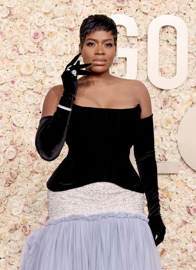 Singer Fantasia Barrino wore a multi-colored strapless dress with finger gloves.