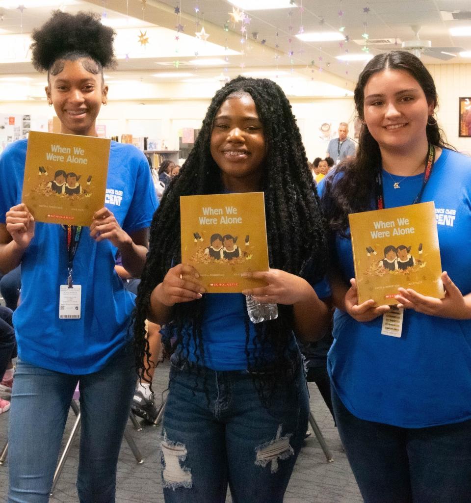 Booker High School students get ready to read to third-graders at Booker Elementary as part of Embracing Our Differences Reading Day.