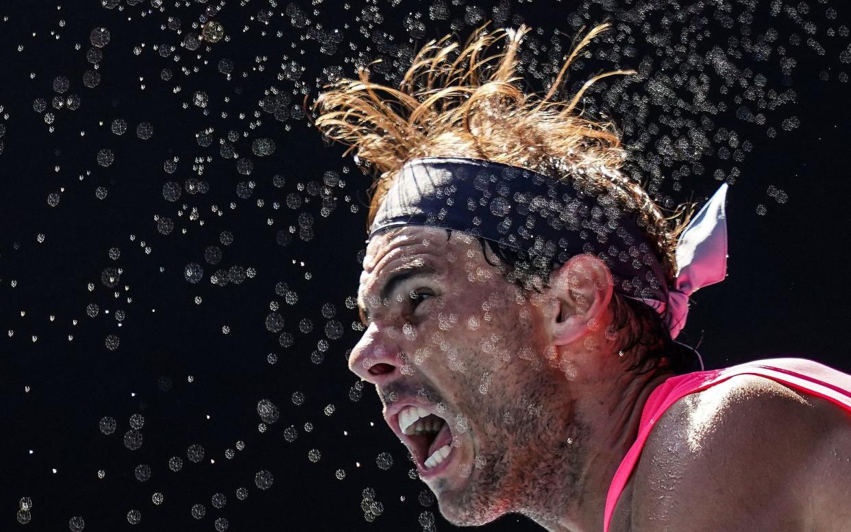 Sweat from Rafael Nadal flies in the air in a 2020 match - SCOTT BARBOUR/EPA-EFE/REX/REX