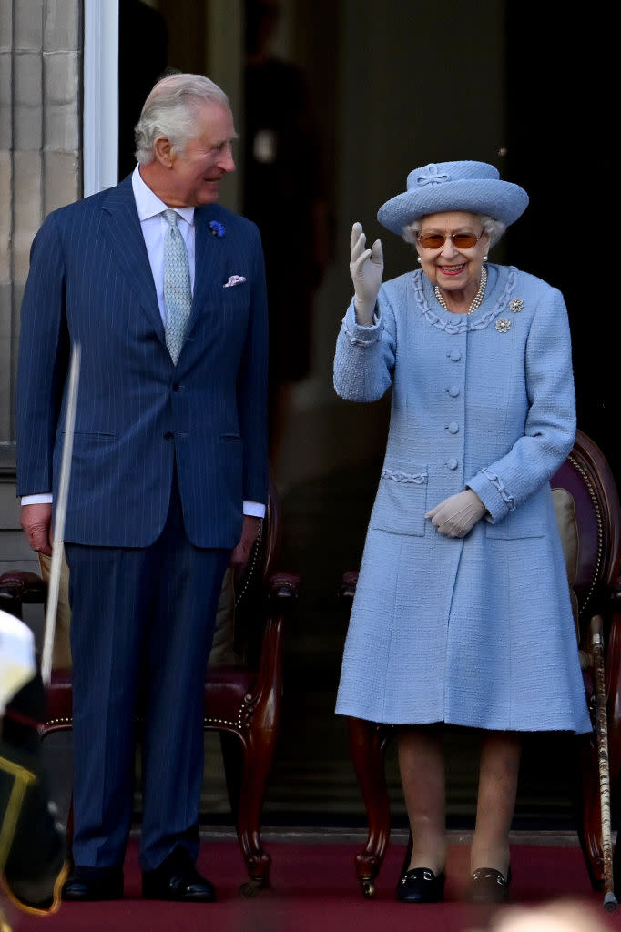 Elizabeth and Charles attend the Royal Company of Archers Reddendo Parade in the gardens of the Palace of Holyroodhouse on June 30, 2022 in Edinburgh on July 1, 2022. (Getty Images)