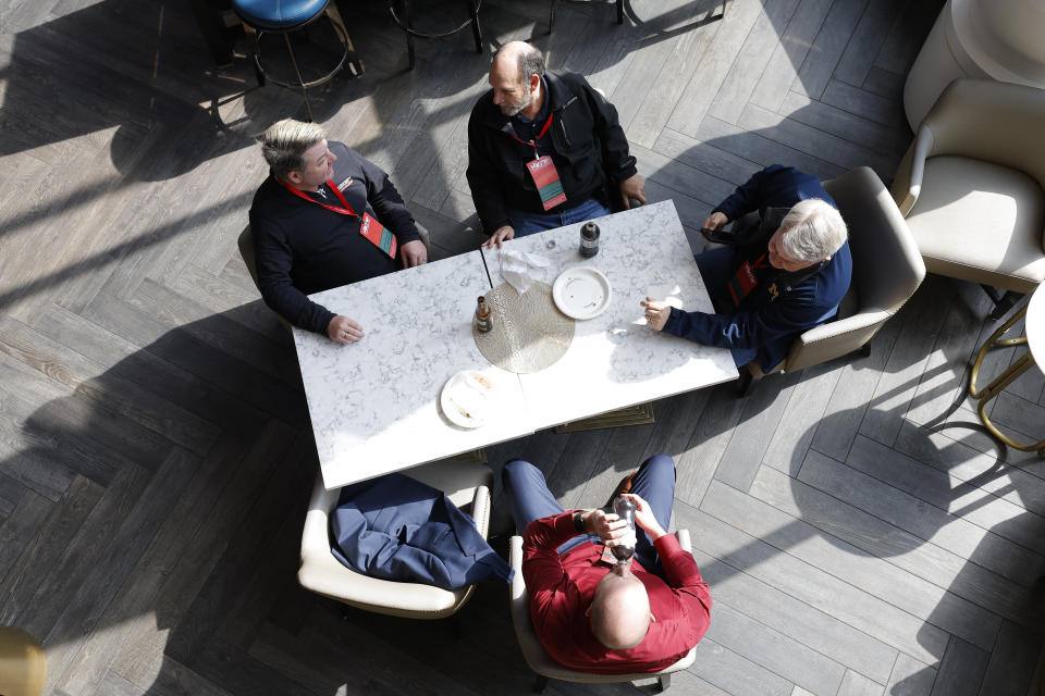 A group of delegates take a break during the Michigan GOP convention, Saturday, March 2, 2024, in Grand Rapids, Mich. (AP Photo/Al Goldis)