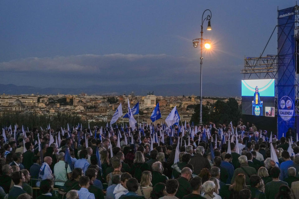 A view of the Azione Party's final rally ahead of Sunday's election in Rome, Friday, Sept. 23, 2022. Italians vote on Sunday for a new Parliament, and they could elect their first far-right premier of the post-war era. If opinion polls hold, Giorgia Meloni could be that premier, as well as become the first woman to lead an Italian government. (AP Photo/Andrew Medichini)