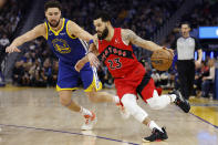 Toronto Raptors guard Fred VanVleet (23) drives to the basket against Golden State Warriors guard Klay Thompson (11) during the first half of an NBA basketball game in San Francisco, Friday, Jan. 27, 2023. (AP Photo/Jed Jacobsohn)