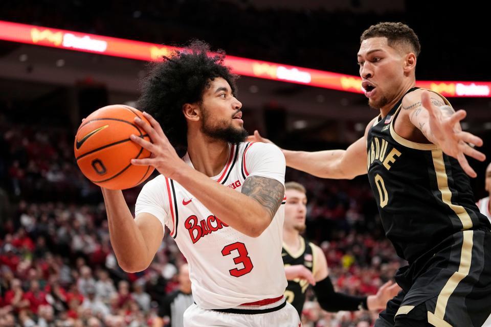 Feb 18, 2024; Columbus, Ohio, USA; Ohio State Buckeyes guard Taison Chatman (3) looks to pass around Purdue Boilermakers forward Mason Gillis (0) during the first half of the NCAA men’s basketball game at Value City Arena. Ohio State won 73-69.