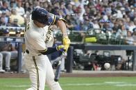 Milwaukee Brewers' Tyrone Taylor hits an RBI single during the second inning of a baseball game against the Tampa Bay Rays Tuesday, Aug. 9, 2022, in Milwaukee. (AP Photo/Morry Gash)