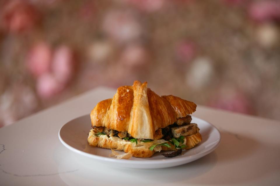 The Za'atar Spiced Chicken Croissant sits on a table at Bien Mérité Thursday, Jan. 4, 2024.