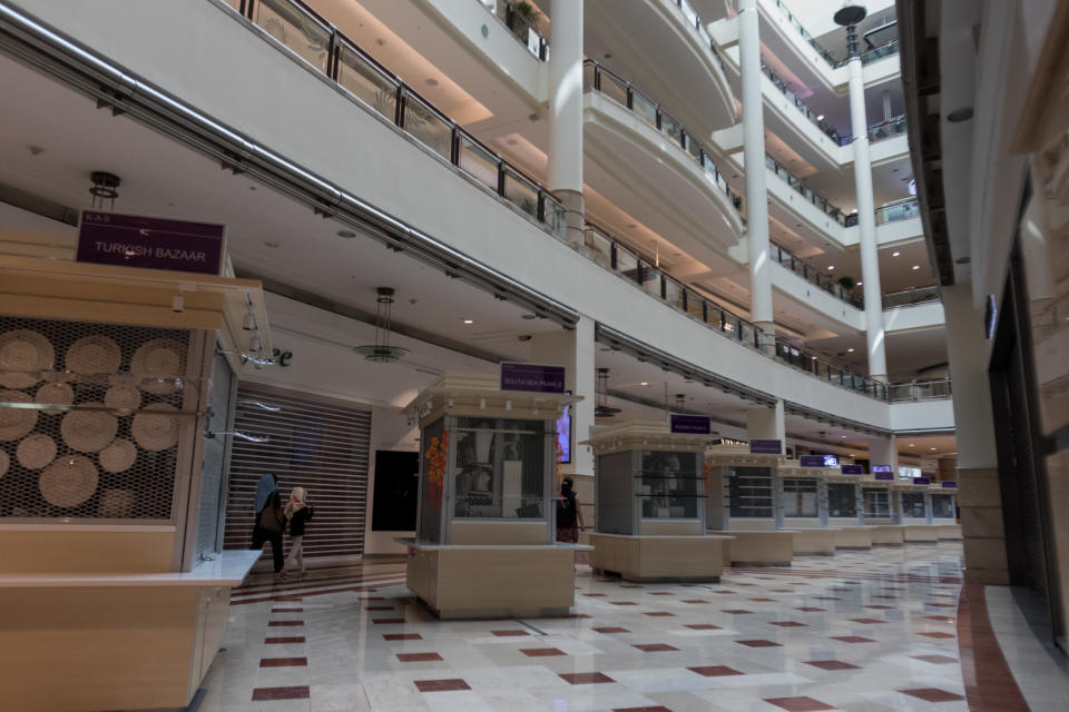 Closed shops seen inside the Suria KLCC shopping mall on 18 March 2020, the first day of the Movement Control Order. (PHOTO: Fadza Ishak for Yahoo Malaysia)