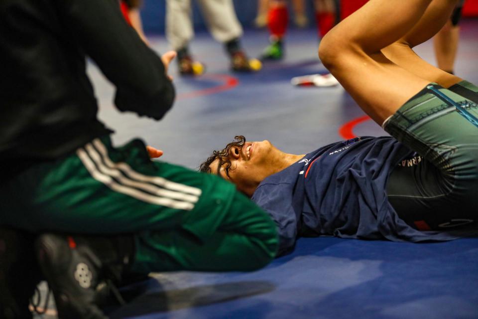 Robert Dawson, 17, of Westland practices with his sister Nakayla Dawson, during wrestling practice at Westland Glenn High School on Tuesday, Jan. 30, 2024.