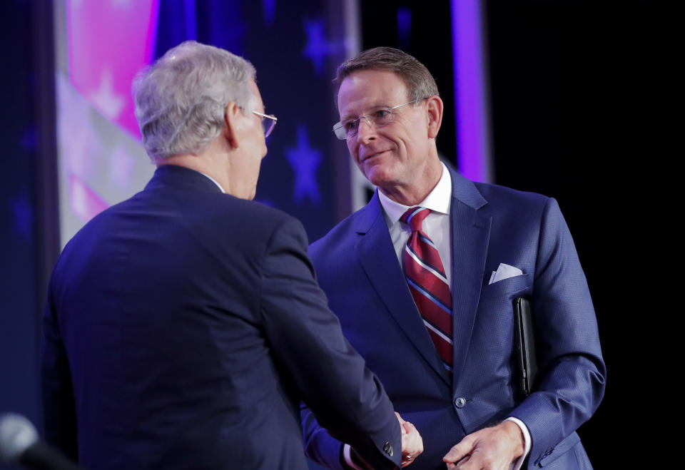 Senate Majority Leader Mitch McConnell of Ky., left, is greeted by Family Research Council president Tony Perkins, right, before speaking to the 2018 Values Voters Summit in Washington, Friday, Sept. 21, 2018. (AP Photo/Pablo Martinez Monsivais)