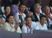 LONDON, ENGLAND - AUGUST 09: Princess Anne, Princess Royal (back L), her husband Sir Timothy Laurence, former athlete David Hemery (back R) Prince Harry (front C) and former rower James Cracknell (front R) watch the athletics on Day 13 of the London 2012 Olympic Games at Olympic Stadium on August 9, 2012 in London, England. (Photo by Jeff J Mitchell/Getty Images)