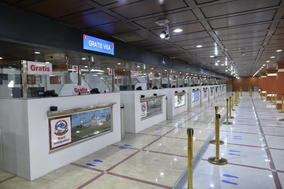 <span class="caption">Social distance stickers to prepare Nepal’s empty Tribhuwan International Airport for reopening.</span> <span class="attribution"><a class="link " href="https://www.gettyimages.com/detail/news-photo/managed-social-distance-sticker-around-the-tribhuwan-news-photo/1216590024?adppopup=true" rel="nofollow noopener" target="_blank" data-ylk="slk:Narayan Maharjan/NurPhoto via Getty Images;elm:context_link;itc:0;sec:content-canvas">Narayan Maharjan/NurPhoto via Getty Images</a></span>