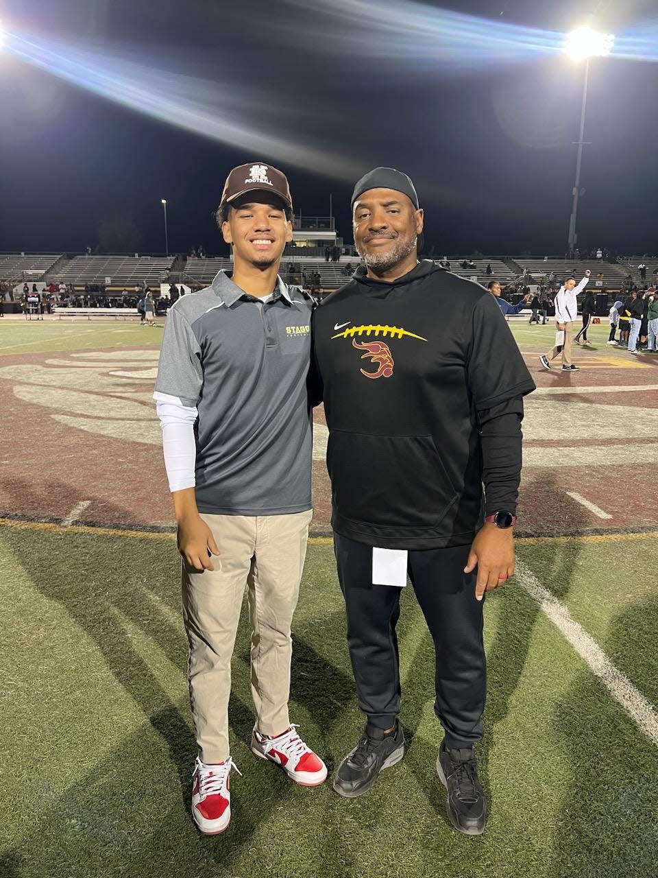 Eric Hankins II (left) and Eric Hankins Sr. (right) pose together during the 2022-23 football season.