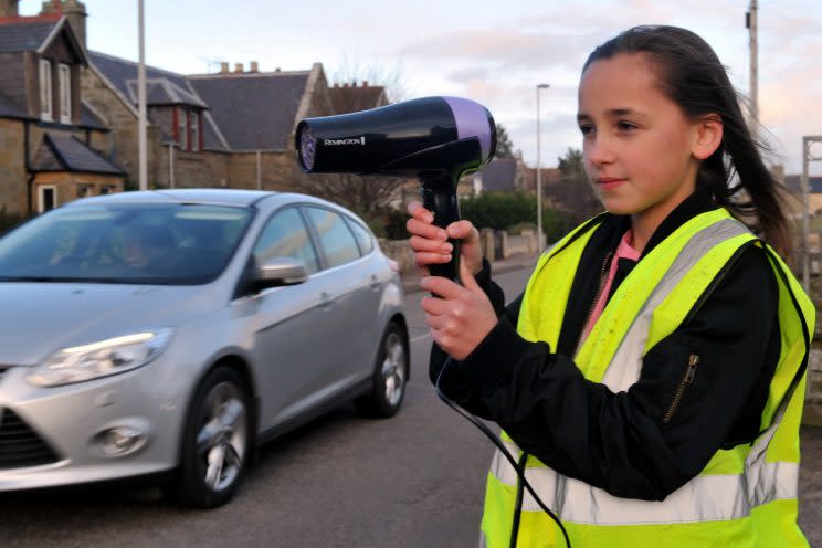 Children have resorted to wearing high-vis vests and pointing hairdryers at speeding cars (credit:SWNS)