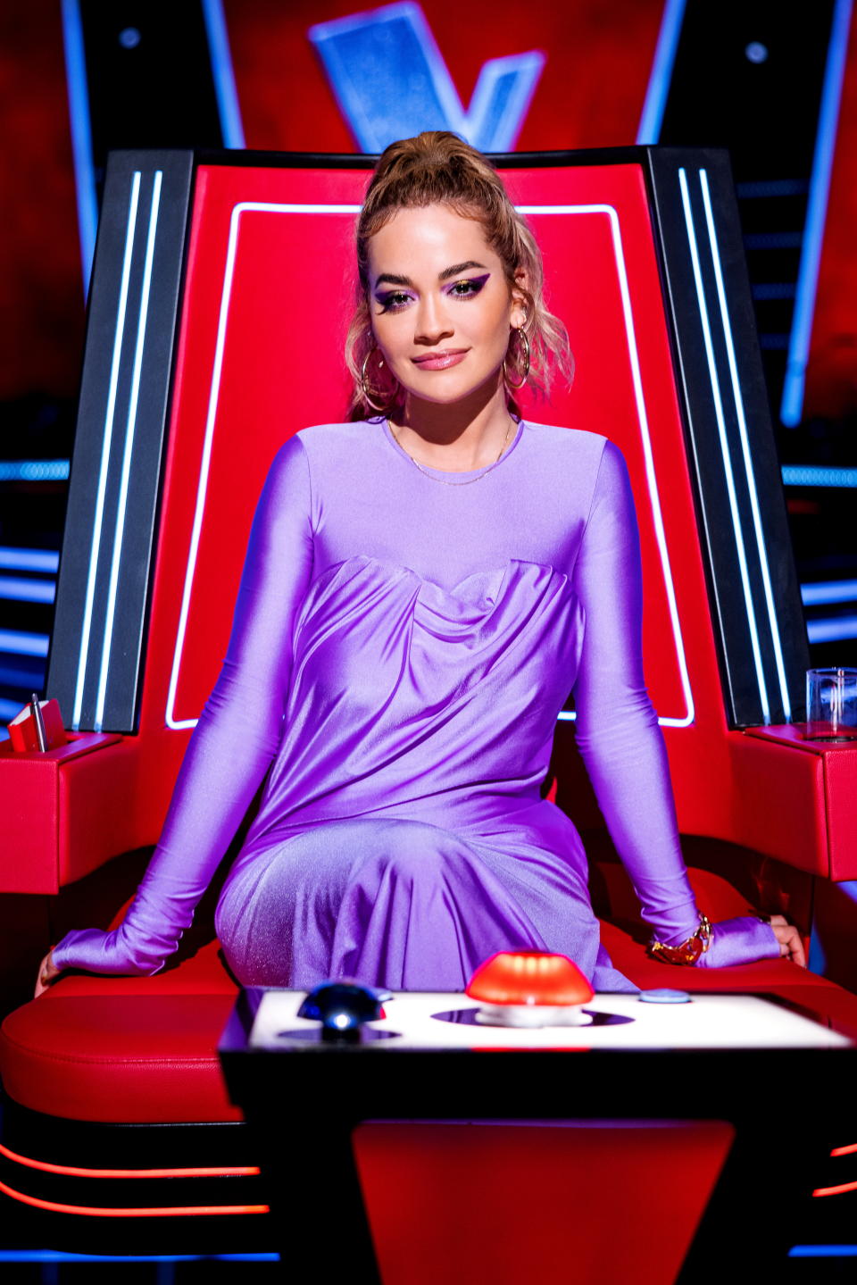 Rita Ora wears a purple slinky dress while judging The Voice
