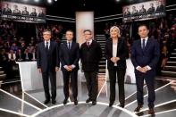 French presidential election candidates (LtoR) Francois Fillon, Emmanuel Macron, Jean-Luc Melenchon, Marine Le Pen and Benoit Hamon, pose before a debate organised by French private TV channel TF1 in Aubervilliers, outside Paris, France, March 20, 2017. REUTERS/Patrick Kovarik/Pool