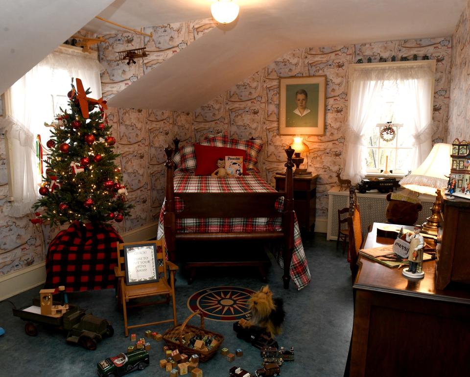 A bedroom in the Stewart Manor House is decorated for "Welcome Home for the Holidays" and "Deck the Hollow" at Quail Hollow Park in Lake Township. The joint events are 5 to 8:30 p.m. Friday, Saturday and Sunday; Dec. 15-17; and Dec. 19-20.