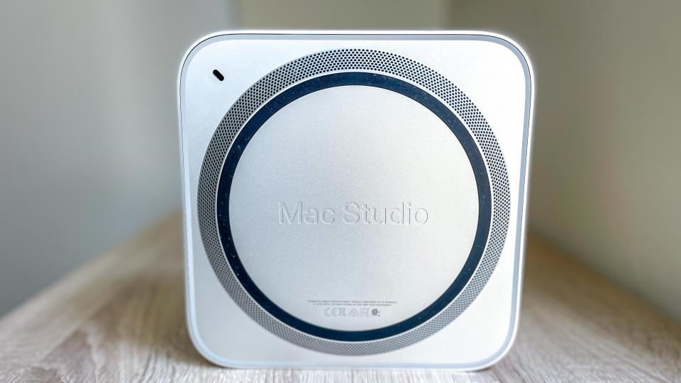 Mac Studio shown from the bottom, standing on its side