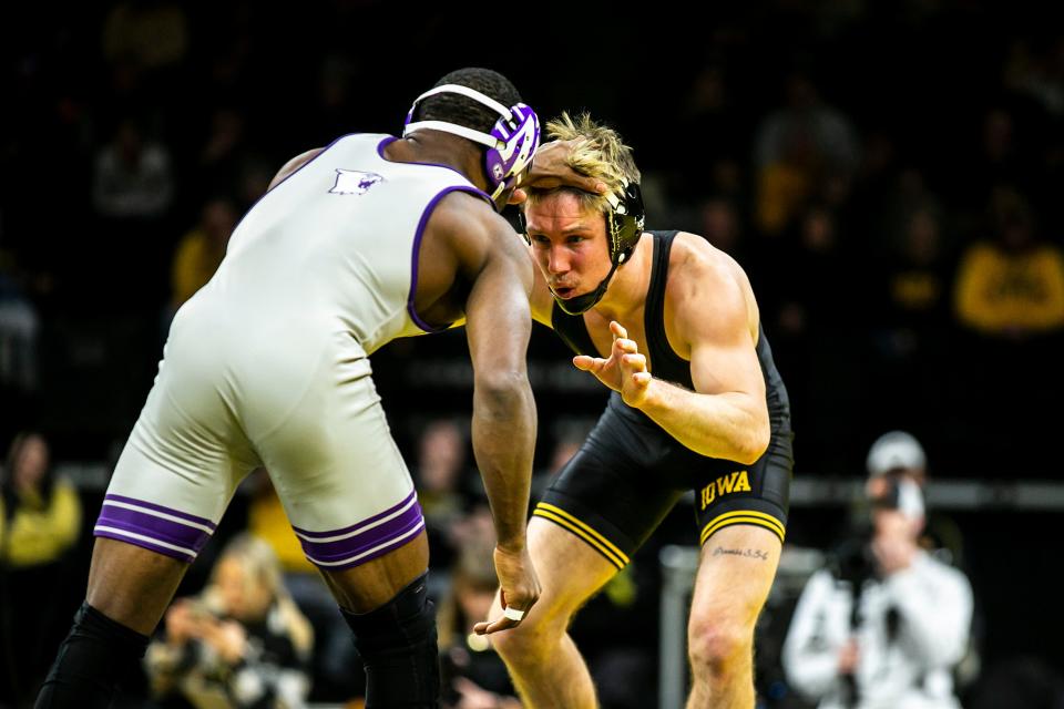 Iowa wrestler Max Murin, right, is 13-3 overall this season and ranked No. 7 nationally at 149 pounds.