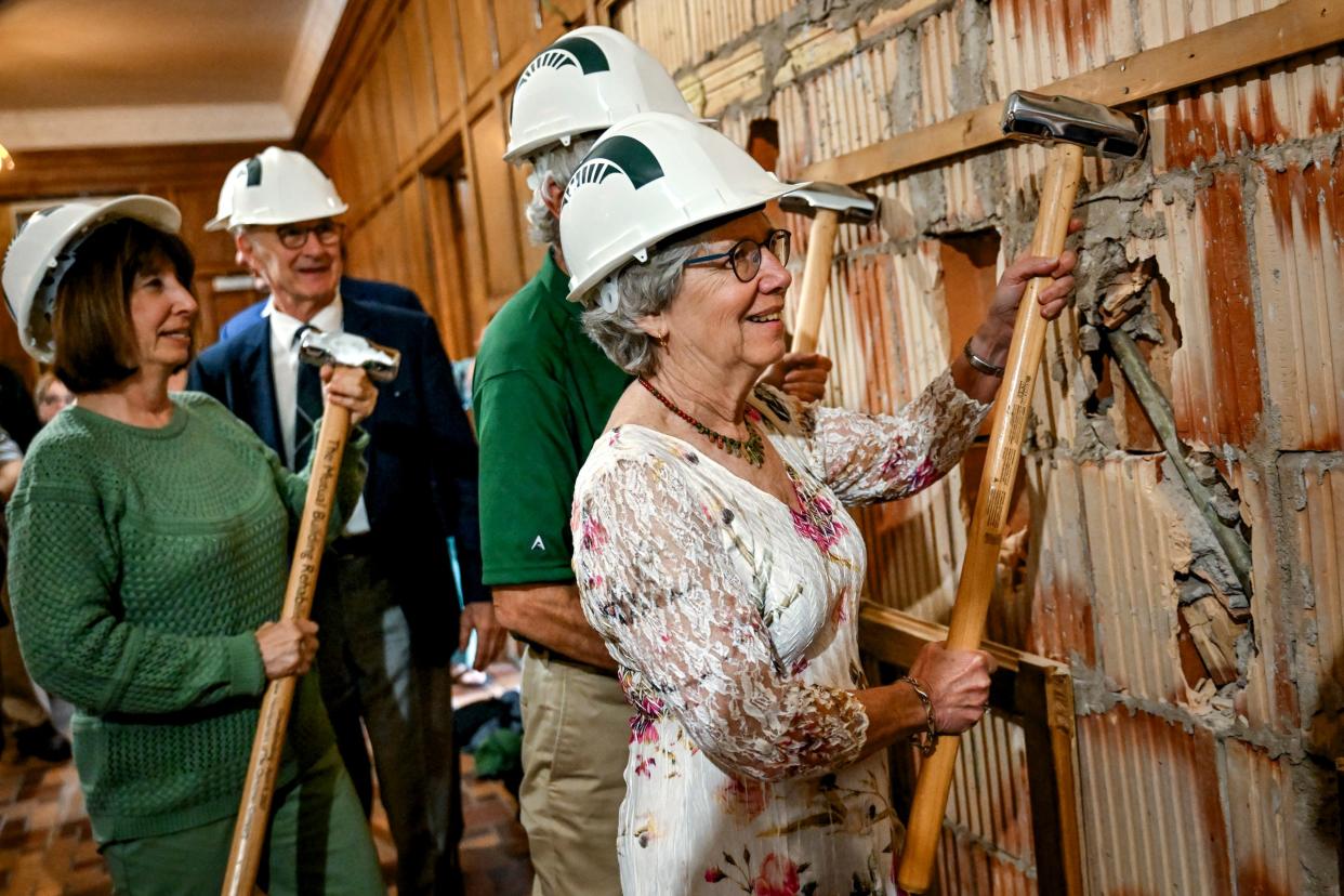 Ruth Hamilton poses near a wall being demolished during a ceremony marking the beginning of the renovations to Michigan State University's Campbell Hall on Friday, May 10, 2024, in East Lansing.